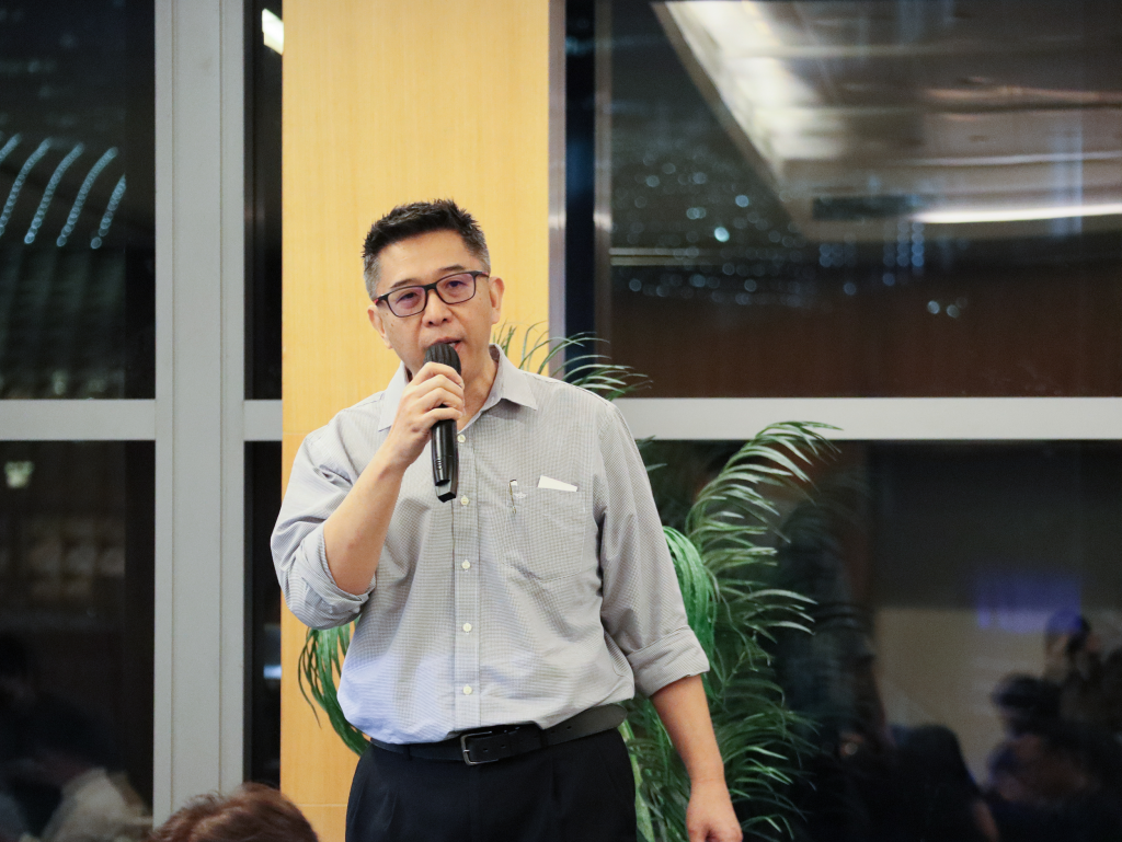 Clifton Chong, QS and IT Manager at Ngai Chin, speaking at the event, sharing insights about the company's service offerings and project successes.